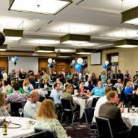 A room full of alumni at a reunion reception